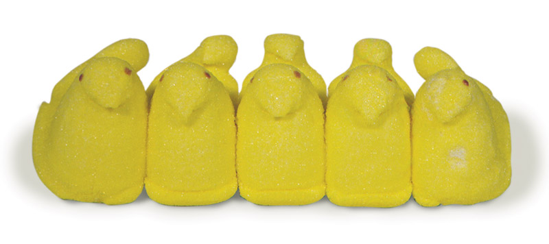 a row of five very dry, yellow, marshmallow peeps